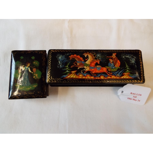 143 - Two Russian black lacquered boxes with pictorial decoration