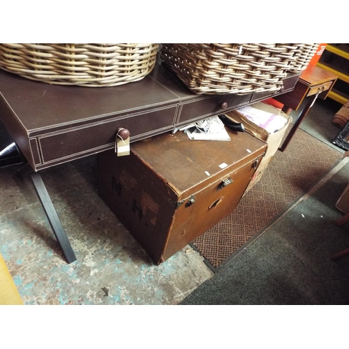 533 - A faux brown leather desk resting on X frame stretcher with three drawers