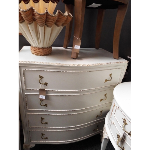 546 - A white painted and gilt banded chest of four long drawers