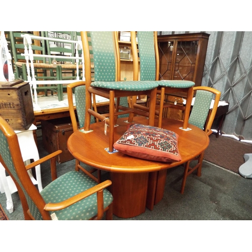 565 - A Danish cherry wood effect oval extending dining table and six matching chairs