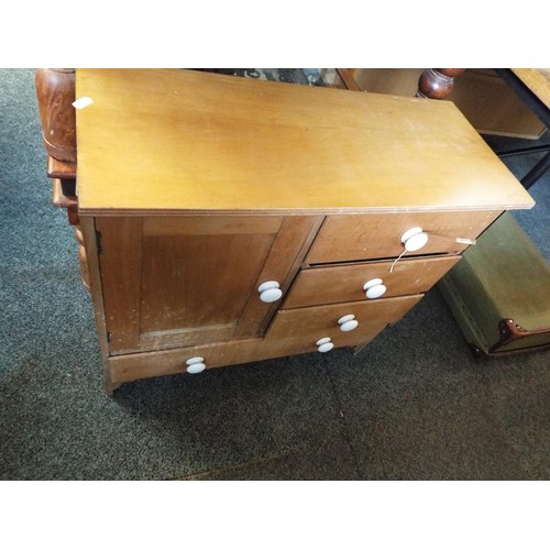 659 - A pine cabinet chest with three short and one long drawer