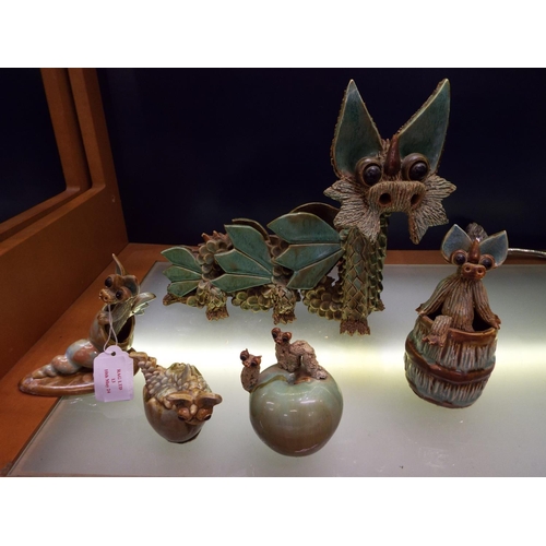 A vintage Yare six legged pottery dragon together with one in climbing ...