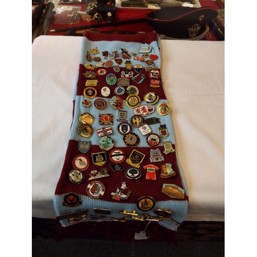 136 - A mixed selection of approx. 87 football club badges mounted on a West Ham United scarf
