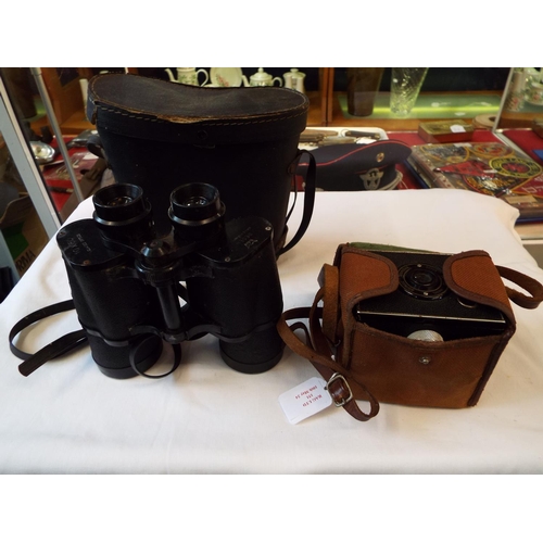 151 - A vintage 'Brownie' Junior Super Six-20 camera and a pair of Regency 10 x 50 binoculars