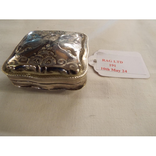 191 - A continental silver pill box with engraved decoration
