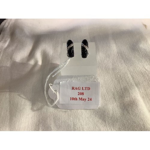 208 - A pair of 14K white gold earrings inset with black onyx and diamonds