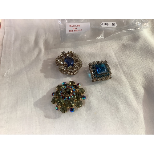 226 - Three costume jewellery brooches