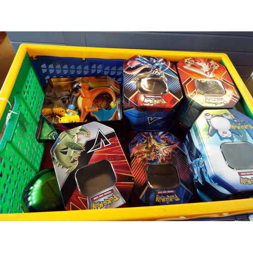 105 - A selection of Pokemon collector’s trading card tins and figurines of Ash & Pickahu battle feature f... 