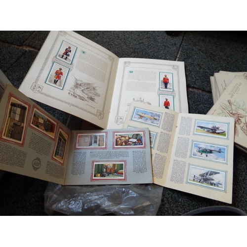 114 - A collection of cigarette cards in albums