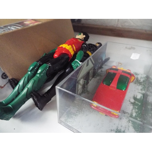 116 - A Batman and Robin figurine together with a Robin car