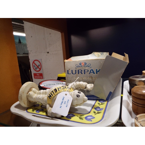 121 - A Lurpak toast rack, Marmite toast rack, Eddie Stobart coasters and a metal Michelin man