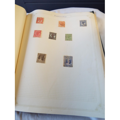 97 - An album housing a quantity of stamps of the world to include 'Queensland', 'Rhodesia', 'Seychelles'... 