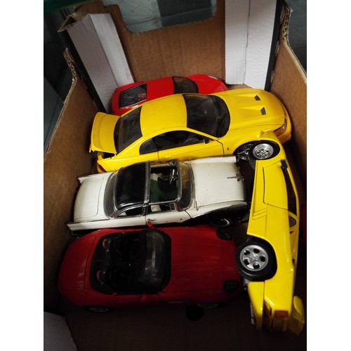 111 - A mixed selection of die-cast vehicles to include a Maisto Ferrari, a Mustang, etc