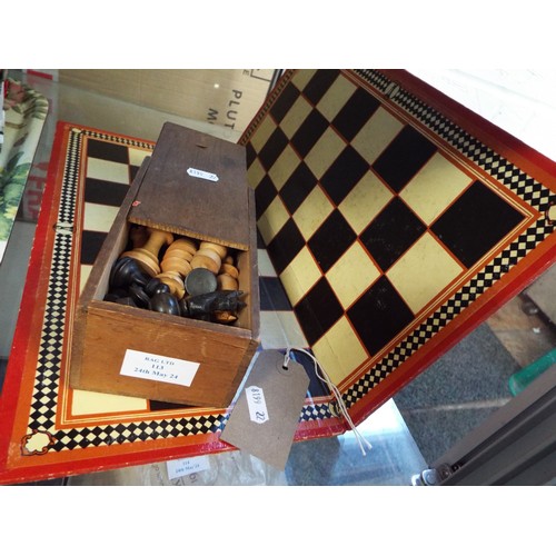 113 - A wooden chess set with a Chad Valley board