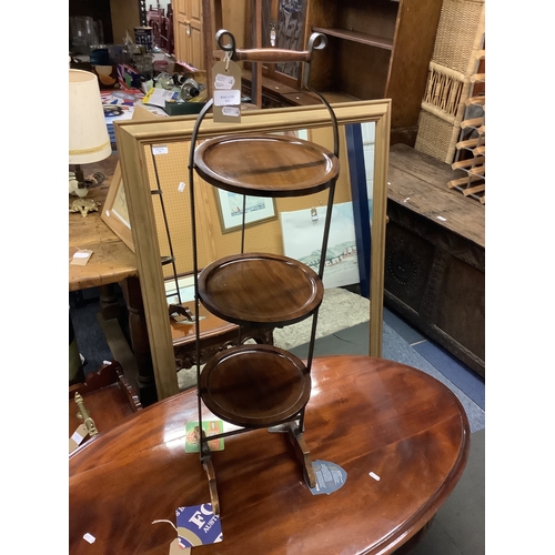 523 - A vintage mahogany folding three tier cake stand