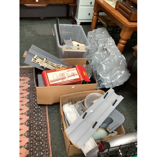 571 - Three boxes of wooden sections and parts to a model railway to include bridge, handmade mountains et... 