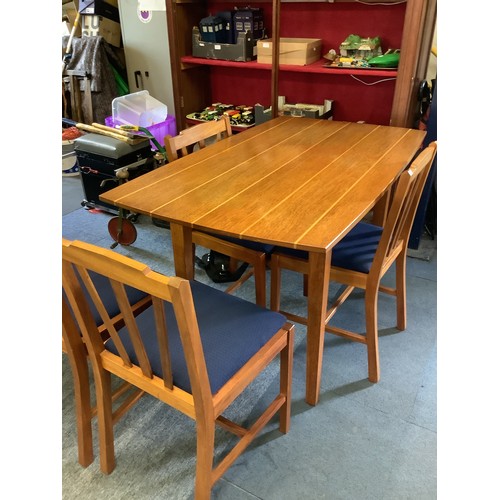 650 - A mid-century hand made teak dining table with satin wood inlay and a set of six matching chairs