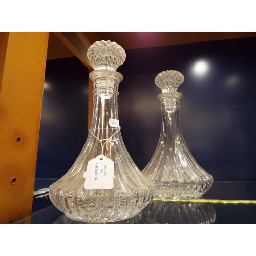 35 - A pair of cut glass decanters