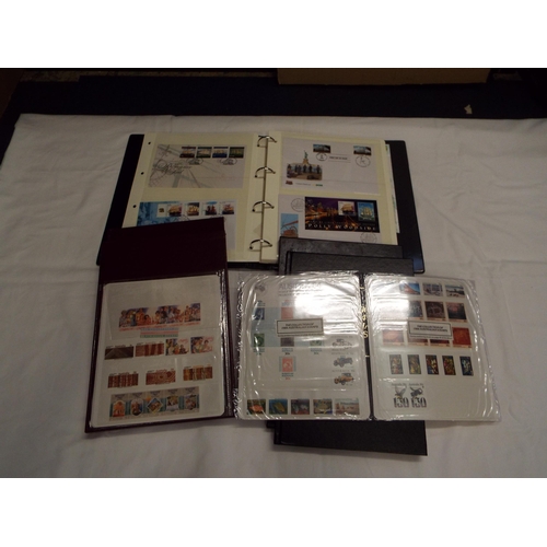 76 - Three albums housing a quantity of Australian stamps