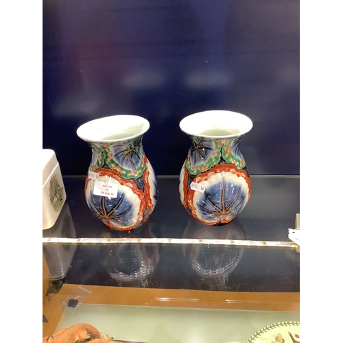 21 - A pair of multi-coloured vases