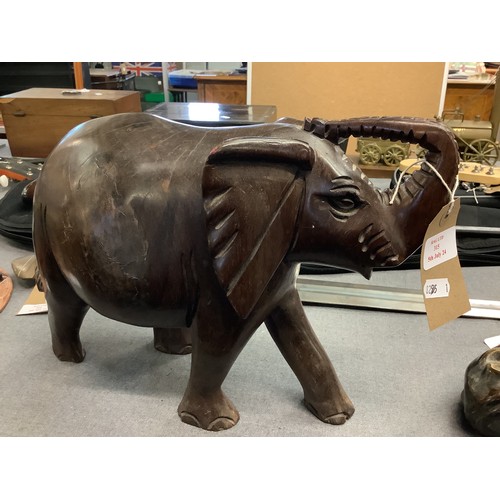 315 - A large carved wooden model of an elephant