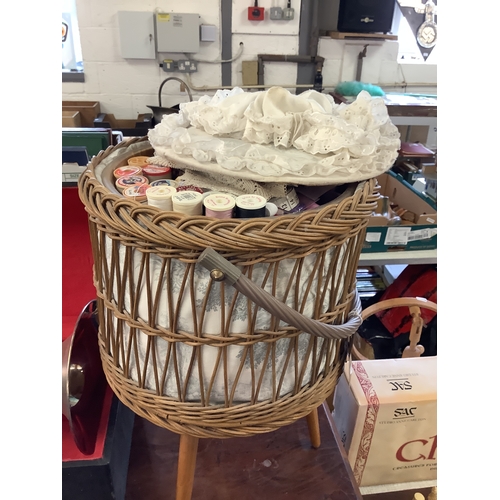 491 - A vintage wicker sewing basket on tri-form legs