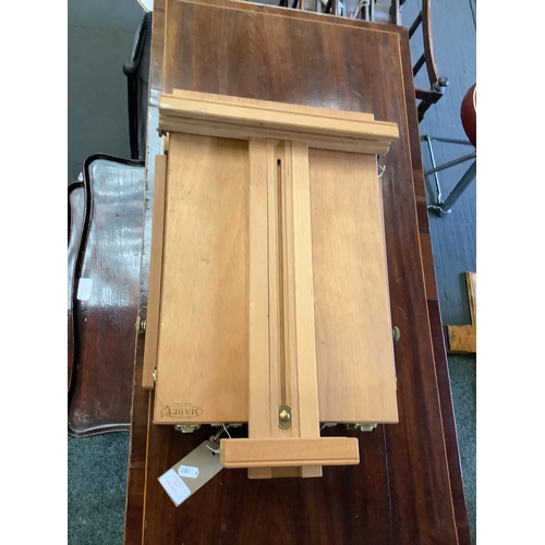 494 - A compact wooden artist's easel stand with contents