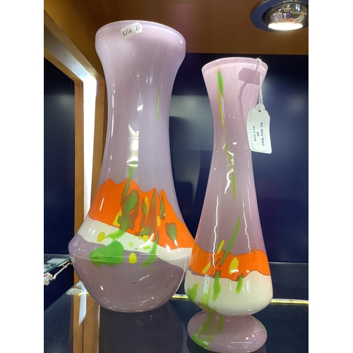 49 - Two USA art glass vases having purple, orange, white and green colourway both signed to base