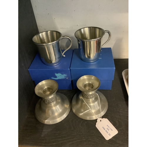 101 - A pair of Haugrud of Norway pewter candlesticks together with two Salisbury pewter cups boxed