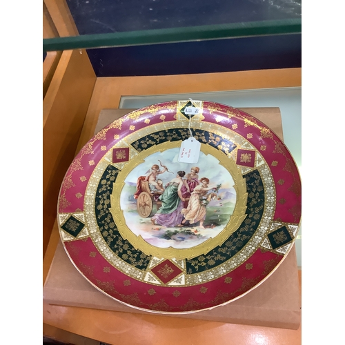 11 - A large Vienna hand-painted plate having pictorial panel