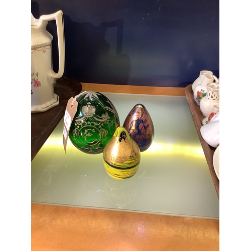 55 - Two Valleta glass paperweights and a Russian glass egg