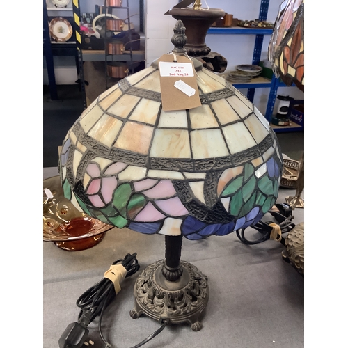 342 - A Tiffany style lamp with cast iron base