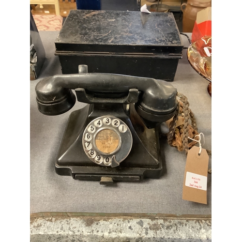 344 - A vintage black Bakelite telephone