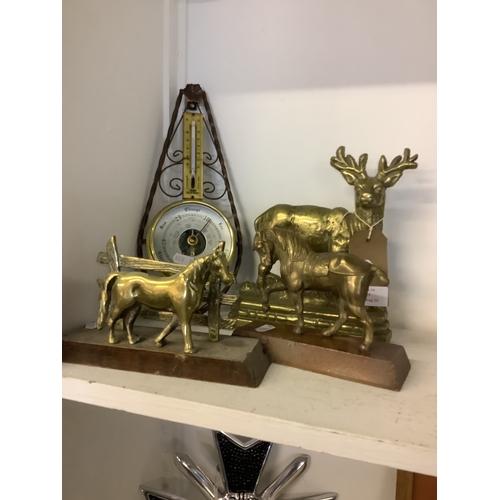 429 - A brass stag doorstop, brass horses and barometer