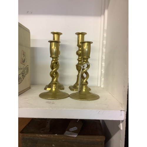 436 - Two pairs of vintage brass candlesticks