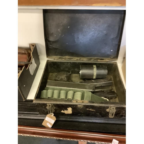 446 - A box of assorted military items to include magazines, cartridge belt, powder flask etc