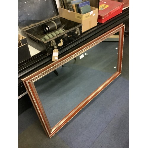 447 - A red and silver framed mirror