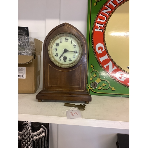 449 - An antique dome top clock with key