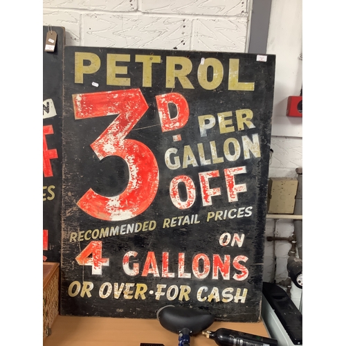 463 - A vintage 1970's hand-painted garage sign 'Petrol 3D off Per Gallon Recommended Retail Price on 4 Ga... 