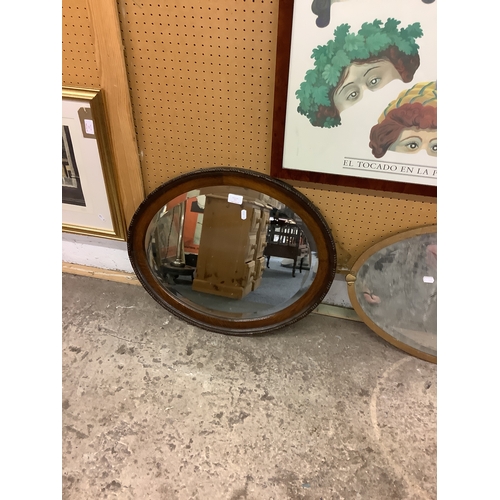 473 - An oak framed bevel glass mirror