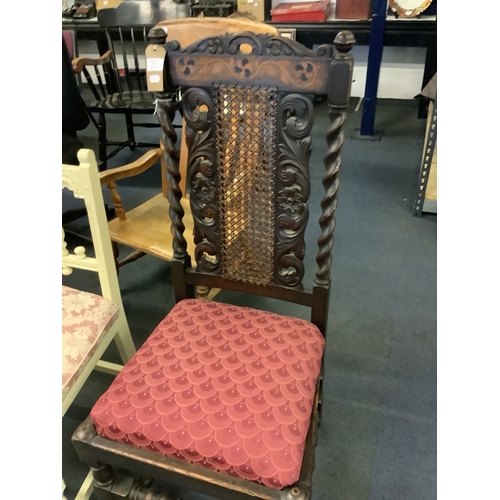 498 - A Victorian oak hall chair having carved splat barley twist supports and bobbin turned stretchers