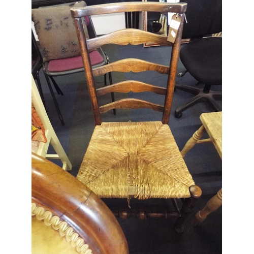 506 - A vintage oak Lancashire ladder back chair with rush seat A/F