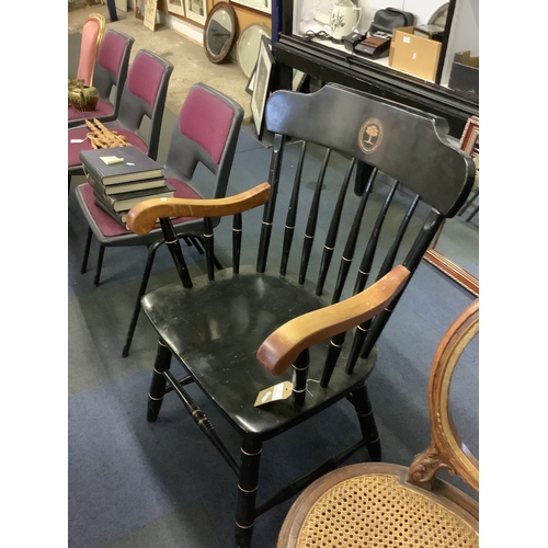 509 - A black and gilt painted spindle back elbow chair for Laurel School