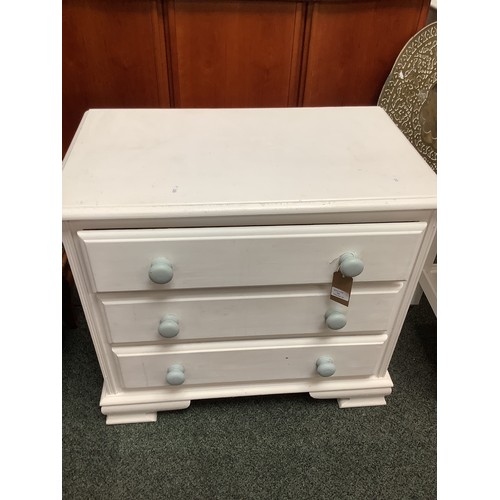 560 - A white painted chest of three long drawers