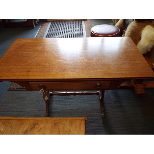 575 - An early 20thC solid oak sofa table with single draw having lyre ends and brass handles and claw fee... 