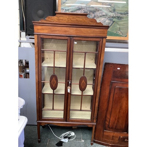 538A - An Edwardian mahogany satinwood strung glass display cabinet