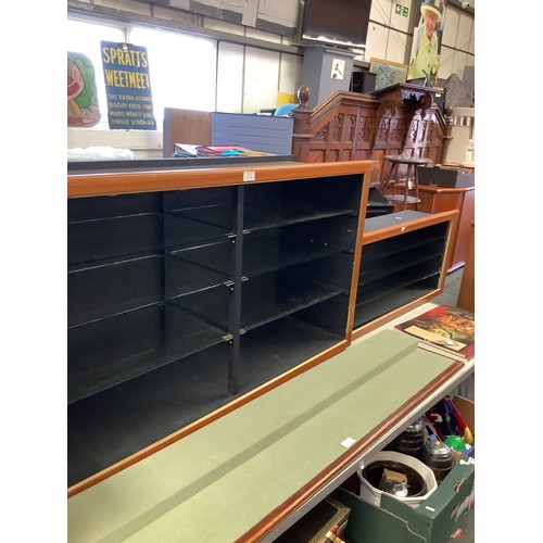 566 - A large black painted model train/car display cabinet on wheels with six glass shelves and another