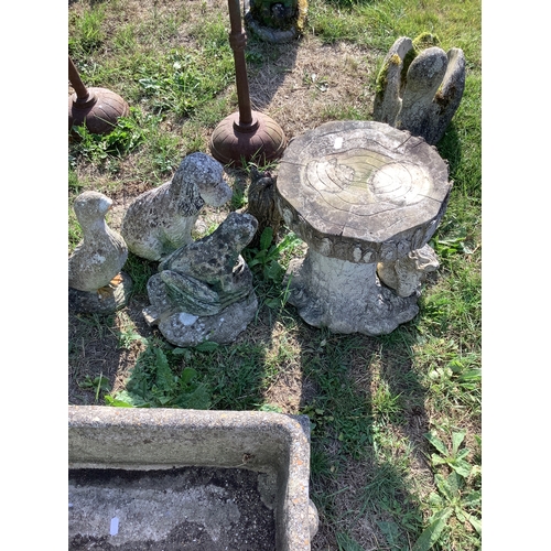 287 - Four concrete garden ornaments and a resin tree trunk