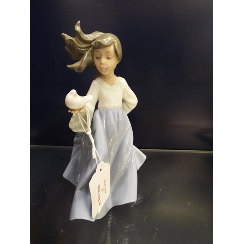 27 - A Nao figurine girl with dove