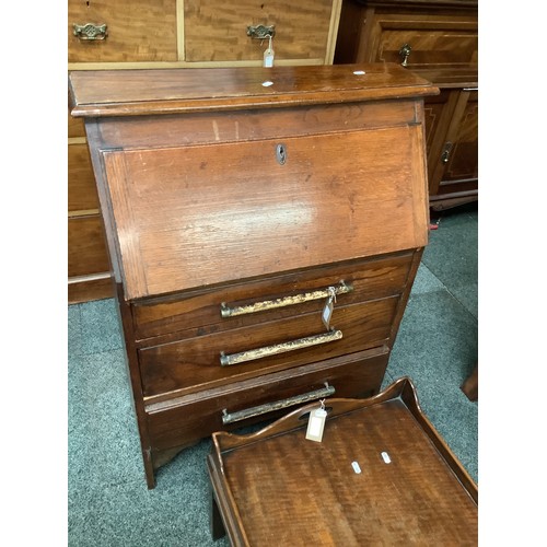 493 - A vintage oak bureau with three drawers under